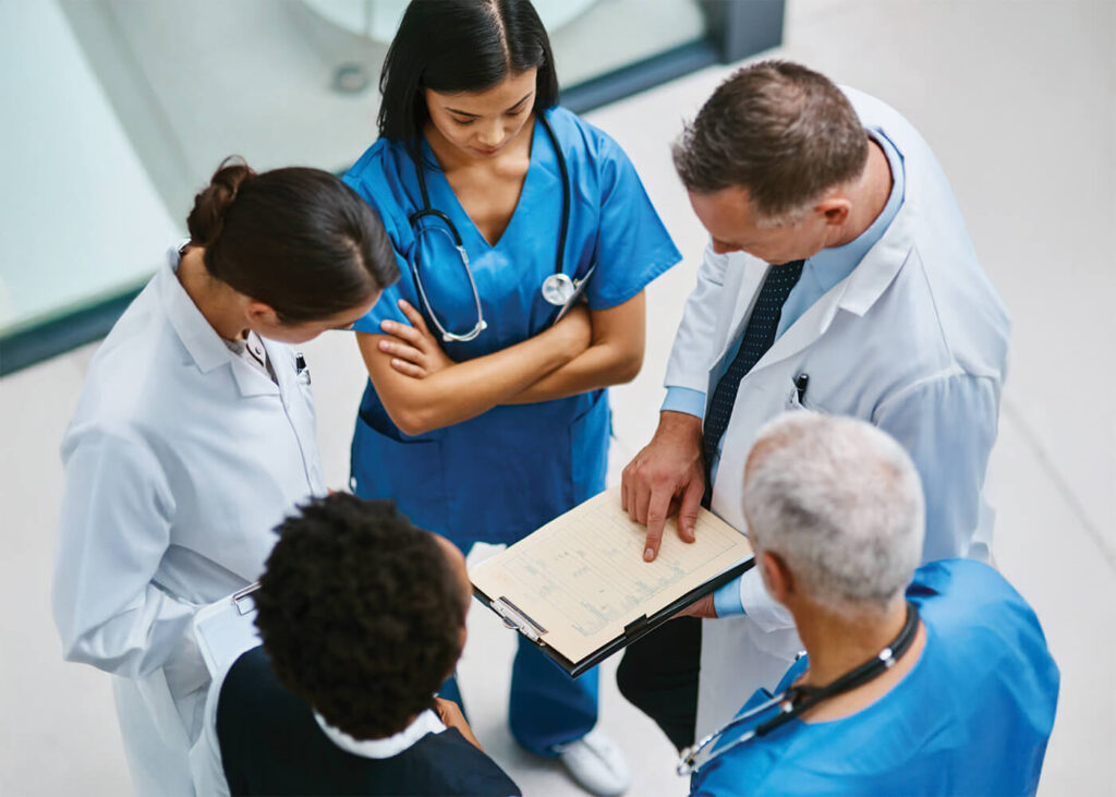 Medical professionals in a hospital's corridor.